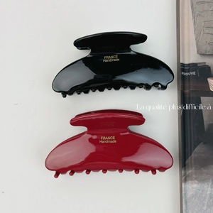 Elegant French style acetate hair claw clips in black and burgundy with gold labels
