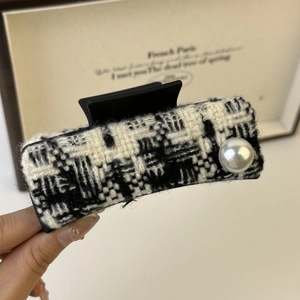 Elegant tweed hair claw clip with pearl embellishment in black and white pattern