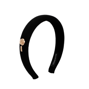 French vintage black velvet padded headband with a golden camellia flower accent