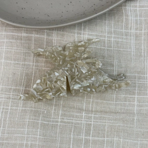 French vintage butterfly hair claw clip with acetate marble texture on linen fabric