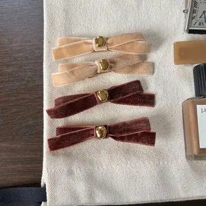 Set of four vintage velvet bow hair clips with gold beads in khaki and brown