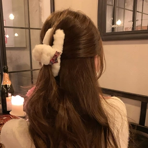 White plush hair claw clip with a red tartan bow for women's elegant hairstyles