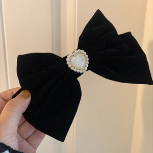 Elegant large black velvet bow hair clip with pearl heart detail for vintage styling