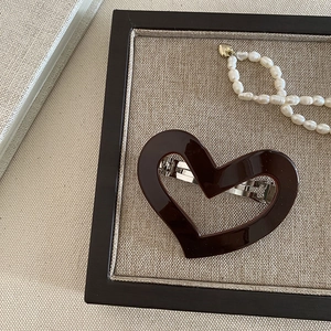 Vintage dark brown hollow heart acetate hair clip with silver metal automatic back fastener