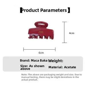 Detailed size specifications of dark red acetate hair claw clip with golden lettering