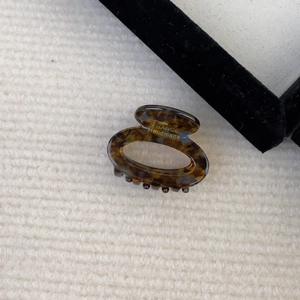 French retro acetate small oval hair claw with elegant tortoise shell pattern and gold stamp