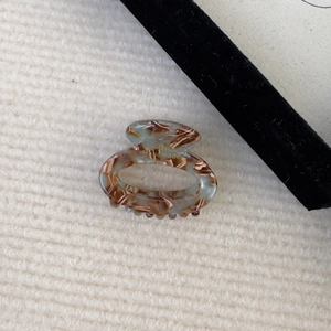 Detail of tortoise shell acetate hair claw clip with gold France Handmade lettering