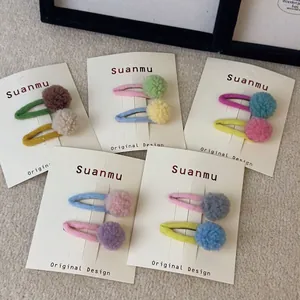 Colorful felt ball hair clips for girls with knit textures and vibrant contrast tones