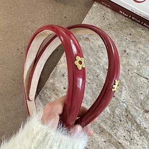 Elegant red PU leather headband with golden bear and flower charms for women