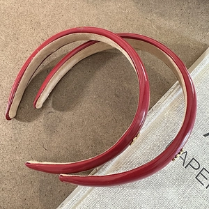 Premium deep red PU leather headband set with glossy finish and metal triangle logo