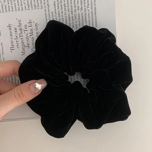 Premium black velvet oversized scrunchie hair tie with soft texture and glossy finish