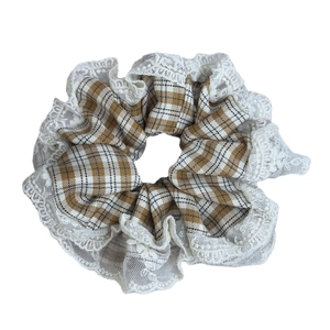 French vintage brown plaid scrunchie with delicate white lace trim on a white background
