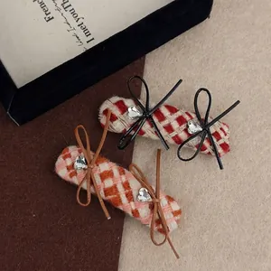 Set of two plaid pattern hair clips with sweet bows and heart crystal embellishments