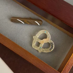 Lrotea minimalist acetate hair clip set with heart shape and rhinestone baguette design