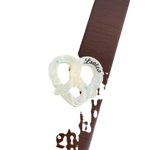 Acetate pretzel-shaped heart brooch with blue crystals and marble texture finish