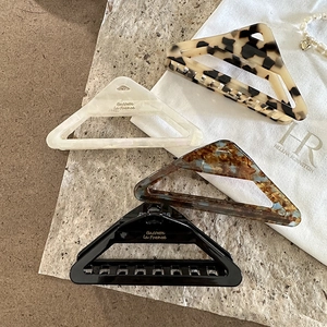 French vintage triangle acetate hair claws in pearl, tortoiseshell, and marble patterns