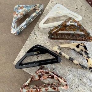 French vintage triangle acetate hair claws in various patterns like tortoiseshell and marble