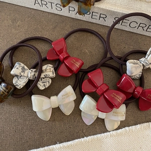 Elegant set of acetic acid bow hair ties with various marble patterns and elastic bands