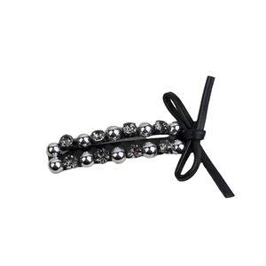 French leather bow hair clip with silver beads and rhinestones on a white background