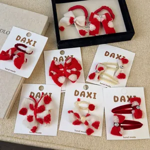 Red and white plush bow hair clips with heart patterns and rhinestones for girls
