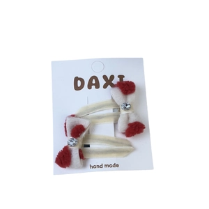 Red and white plush bow hair clips with oval rhinestone center for festive girls' hair