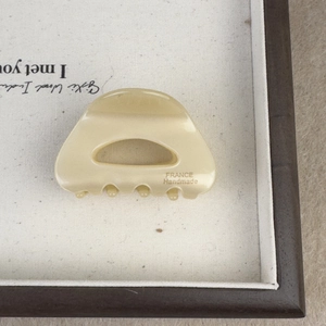 French style cream acetate hair claw clip with curved cutout and handmade gold lettering