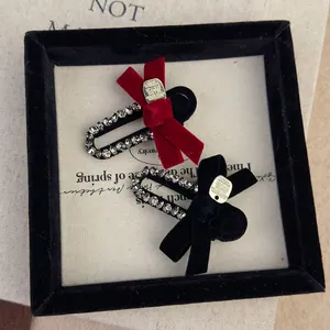Vintage velvet bow hair clips with rhinestones and gold charms in black and red colors