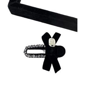 Elegant black velvet bow hair clip featuring gray rhinestones and a metal plate inlay