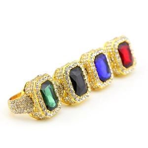 Detailed macro view of hip hop square gold rings with iced out rhinestones and colorful gems