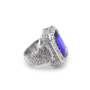 Macro view of hip hop square ring with deep blue center stone and side pavé setting