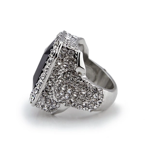 Macro detail of men's wide silver ring with rectangle black stone and pave crystals
