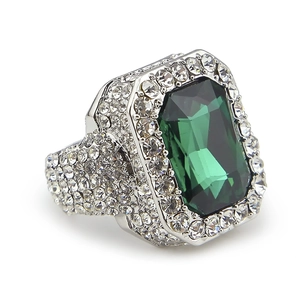 Detail of square emerald-cut green gem on silver band with pavé micro-set diamonds