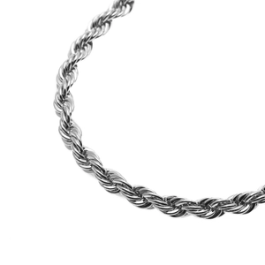 Macro shot of 6mm silver rope chain showing detailed twisted weave and metallic texture