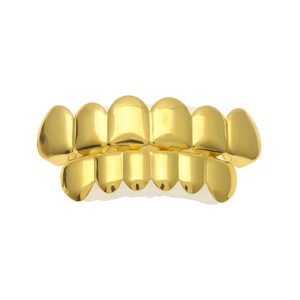 Detailed view of hip hop gold teeth grillz set with silicone molding bars