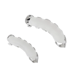Detail view of silver hip hop grillz set with white silicone molding bars for teeth