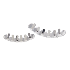 Close-up of polished silver hip hop grills for teeth set on a clean white background