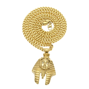 Gold vintage Pharaoh head pendant necklace with cubic zirconia eyes on a chunky cuban link chain