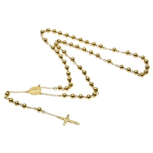 Détail d'un collier chapelet plaqué or avec croix et médaillon de la Vierge Marie