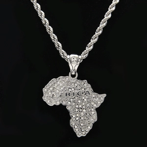 Close-up of iced out Africa map pendant with shiny diamonds on silver twist chain