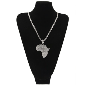 Detailed close-up of iced out silver Africa map pendant with luxury rhinestones