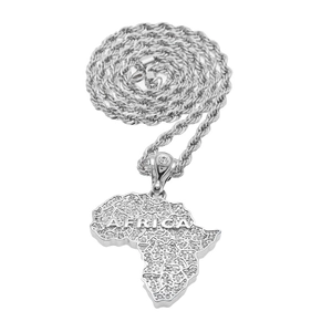 Macro shot of silver hip hop Africa map pendant with iced out crystals and rope chain