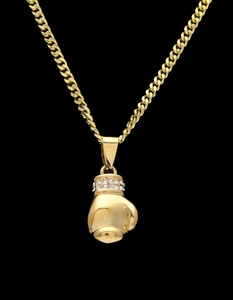 Detail of a golden boxing glove pendant with rhinestones on a high-quality curb chain