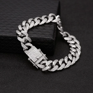 Macro shot of silver iced out Cuban link bracelet with pavé cubic zirconia diamonds