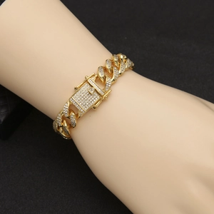 Men's hip hop 13mm gold Cuban link bracelet with iced out diamond clasp on wrist