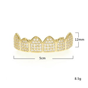 Detailed view of hip hop gold grillz set with sparkling white cubic zirconia stones