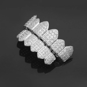 Detailed view of silver hip hop grillz with shimmering pavé zircon geometric teeth sets