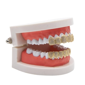 Macro shot of hip-hop gold plated grillz set with micro-pave white cubic zirconia stones