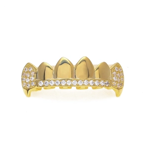 Macro shot of hip hop grillz featuring gold plated metal and micro-paved AAA cubic zirconia