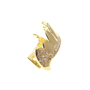 Close-up of hip hop gold plated wing grillz with sparkling micro-inlaid AAA zircon stones