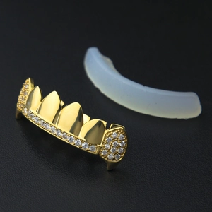 Macro detail of hip hop gold plated grillz with AAA cubic zirconia stones and silicone bar